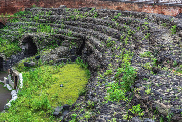 Ruins of Roman Amphitheater on Stesicoro Square, historic part of Catania, Sicily Island, Italy