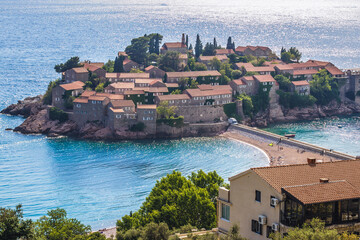 View of Sveti Stefan islet and five star Aman Sveti Stefan hotel resort, Montenegro - obrazy, fototapety, plakaty