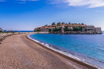 Beach of Sveti Stefan islet with Aman Sveti Stefan hotel on Adriatic shore, Montenegro