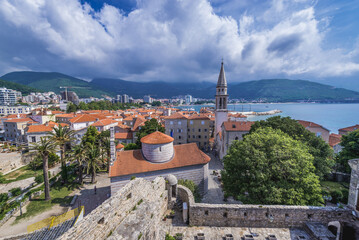 View from historic Citadel on Old Town of Budva town with Holy Trinity Church, Montenegro