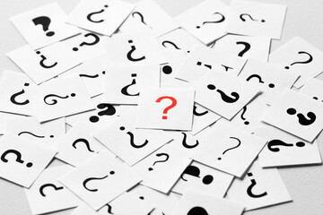 Pile of question mark signs scattered around as a background. Question, decision making, answers, facts concept - 775826398