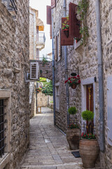Narrow alley of Old Town, historic part of Budva town, Montenegro