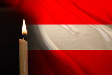 mourning candle burning front of flag Austria, Victims of cataclysm or war concept, memory of...