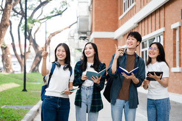 Diverse group of young adults from Asia and beyond, enjoying university life together. happy,...