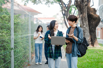 Diverse group of young adults from Asia and beyond, enjoying university life together. happy,...