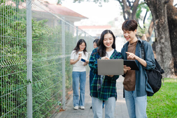 Diverse group of young adults from Asia and beyond, enjoying university life together. happy,...