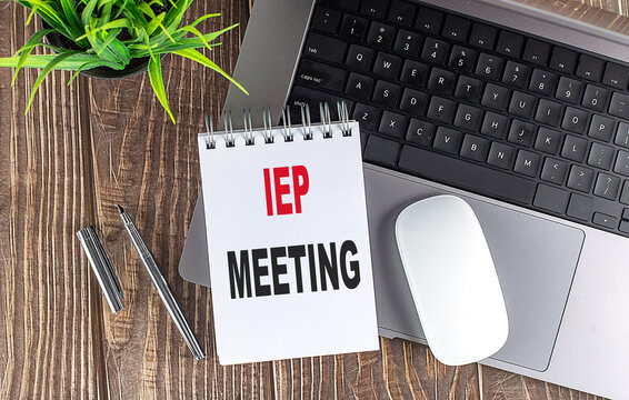 IEP MEETING text on notebook with laptop, mouse and pen