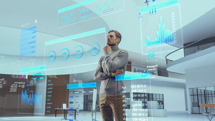 Portrait of Futuristic Businessman Activating Data Analysis in a Virtual Space. Person Gesturing with Augmented Reality Hologram Information, Financial Reports, Stock Market Reports, Infographics