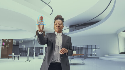 Futuristic Black Business Leader Businesswoman Standing in a Virtual Space, Gesturing with an...