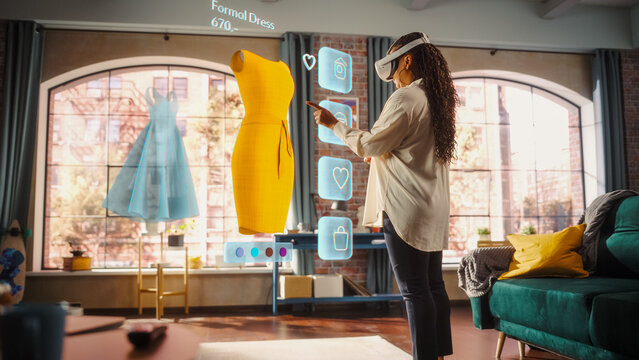 Black Woman Using Virtual Reality Headset for Online Shopping, Browsing through Stylish Dresses and Clothing items. Ordering from Mock-up Internet Store App for e-Commerce products. Augmented Reality