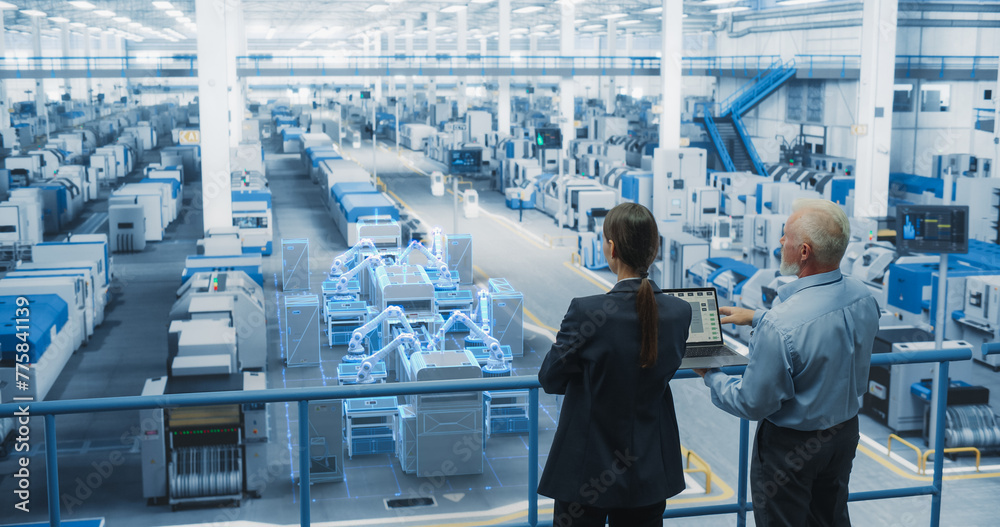 Poster Male and Female Standing at Electronics Factory, Using Computer and Having a Conversation. Augmented Reality Visualization of a Conveyor Belt Production Line with Robot Arms Appears In Front of Them