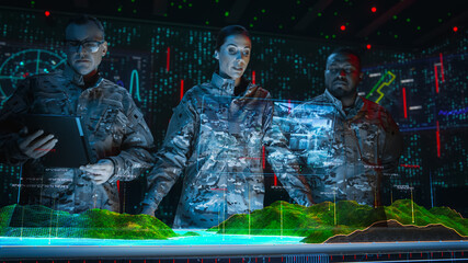 High-Tech Warfare: Military Intelligence Specialists use Holographic Augmented Reality Table Map to...