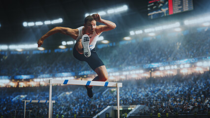 Strong Male Athlete is Running Towards an Obstacle, Hurdling, Jumping Over the Barrier in Front of...