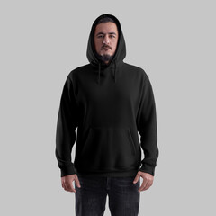 Mockup of a black oversized hoodie on a brutal man in a hood, wide clothing with a pocket, laces, cuff, front.