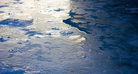 Frozen, icy surface, slippery road. Cold, ice, climate.