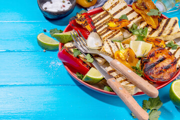 Summer vegan barbeque recipe. BBQ healthy balanced vegetarian food, grilled roasted tofu cheese steaks with vegetables