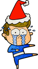 hand drawn textured cartoon of a crying dancer wearing santa hat