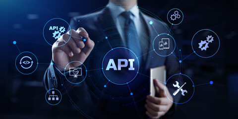 API Application programming interface. Businessman pressing virtual button.