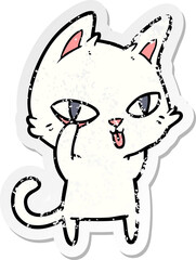 distressed sticker of a cartoon cat staring