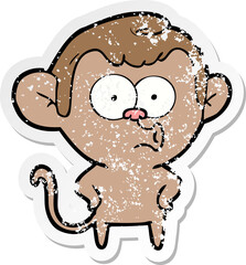 distressed sticker of a cartoon surprised monkey