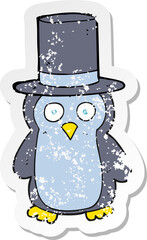 retro distressed sticker of a cartoon penguin wearing hat