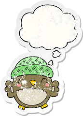 cute cartoon owl in hat with thought bubble as a distressed worn sticker