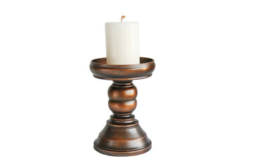 A white candle burns on a stylish candle holder