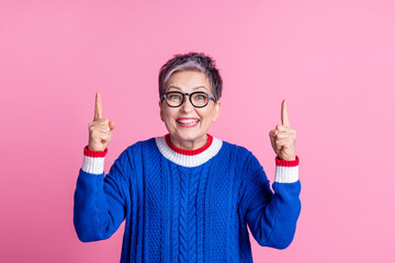 Photo of positive nice funny retired woman wear stylish blue clothes advertise product news empty...