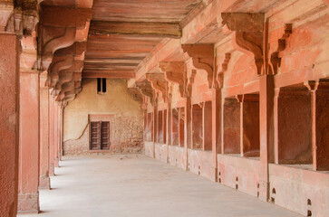 Corridor constructed with red sandstone. Mughal architecture at Fatehpur Sikri near Agra, Uttar Pradesh, India.