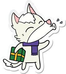 sticker of a howling wolf with christmas present