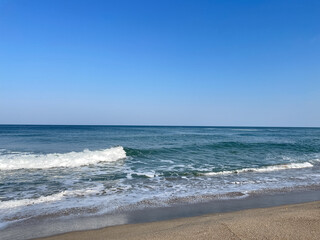 Fototapeta na wymiar Beach background image, blue sea, clear sky