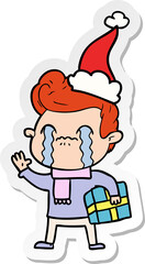 hand drawn sticker cartoon of a man crying wearing santa hat