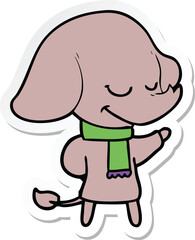 sticker of a cartoon smiling elephant wearing scarf