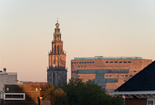 The Martinitoren and teh Forum building on a clear morning in the historical city centre of Groningen.