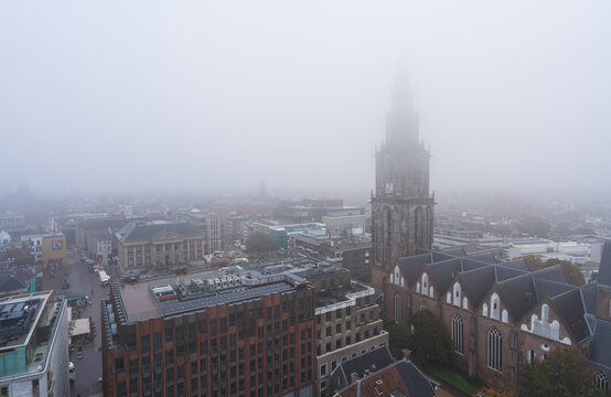 The Martinitoren on a foggy morning in the historical city centre of Groningen.