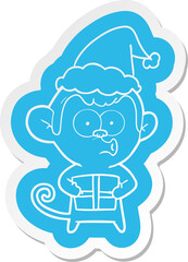 quirky cartoon  sticker of a christmas monkey wearing santa hat