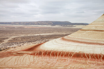 Unique geological feature known as tiger-striped mountains, showcasing layers of sedimentary rock...