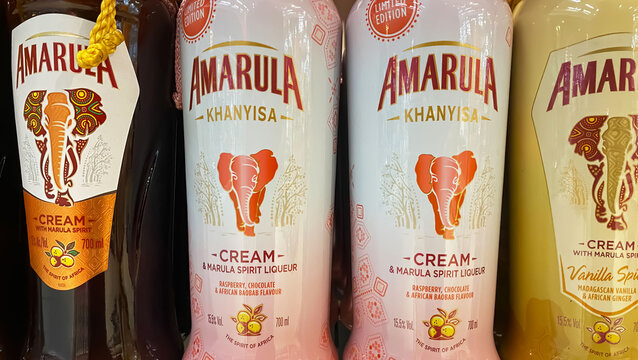 Viersen, Germany - April 3. 2024: Closeup of bottles Amarula liqueur choice in german store shelf (focus on center)