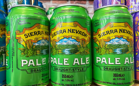 Viersen, Germany - April 3. 2024: Closeup of Sierra Nevady brewing company pale Ale beer cans in german store shelf (focus on center)