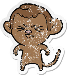 distressed sticker of a cartoon annoyed monkey