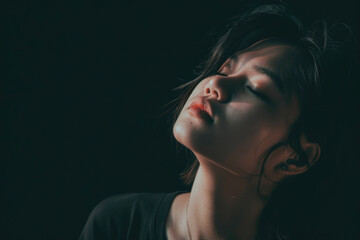 A creative and artistic photo of a person's face with their eyes closed and their head tilted back