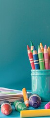 A simple, vibrant image of crayons and a coloring book on a desk, symbolizing early learning - obrazy, fototapety, plakaty