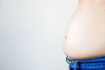 fat mature man check out body overweight abdomen his belly for white or obesity background. Weight...