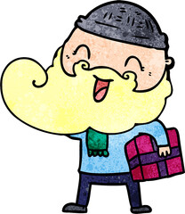 Fototapeta premium happy bearded man holding christmas present