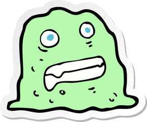 sticker of a cartoon slime creature