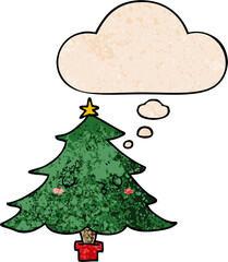 cute cartoon christmas tree with thought bubble in grunge texture style