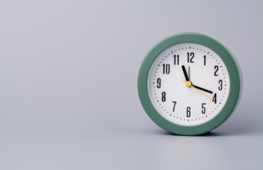 Modern alarm clock ticking, standing still time, time concept, time photography in studio.