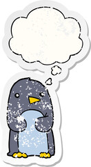 cartoon penguin with thought bubble as a distressed worn sticker