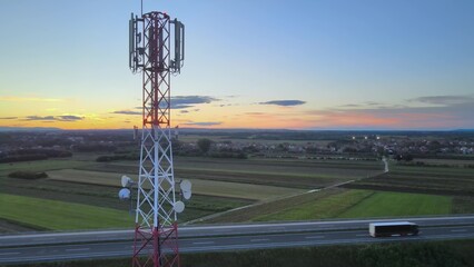 Futuristic truck with self driving autopilot. Navigation by 5G telecom tower. Aerial