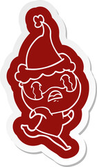 quirky cartoon  sticker of a bearded man crying wearing santa hat